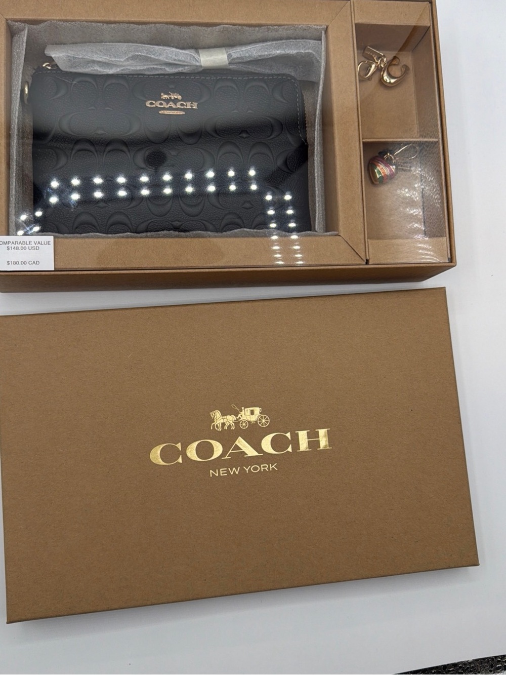 Coach women’s boxed wristlet in black leather